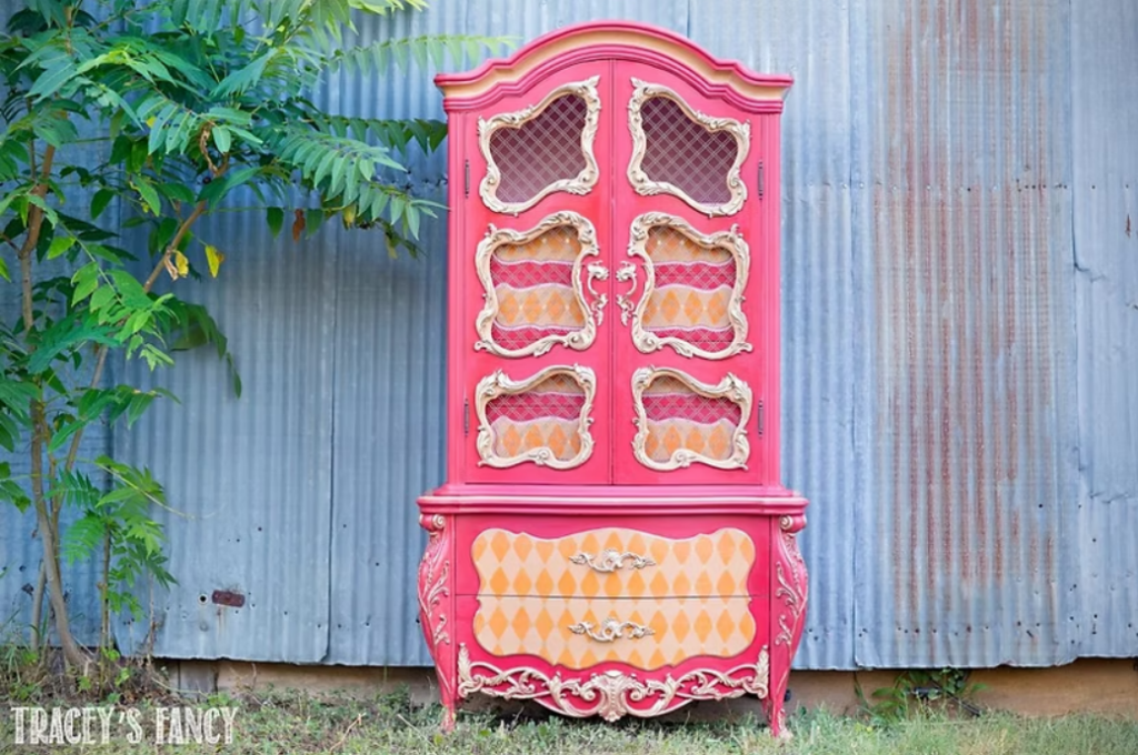 beautiful bold pinks and patterns mixed on an old armoire by Tracey's Fancy