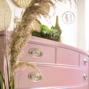 Up close picture of a dresser painted pink with Moonshine metallic painted on.