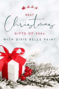 Pinterest pin with a white present with red ribbon, red berries and green pine needles sitting on a table top, the words Best Christmas Gifts of 2024 with Dixie Belle Paint is printed above the gift in front of a white sparkly background