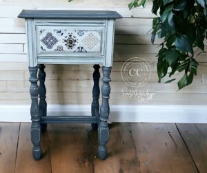 A two-toned blue painted bedside table with Sapphire Sonata transfer applied to the front drawer